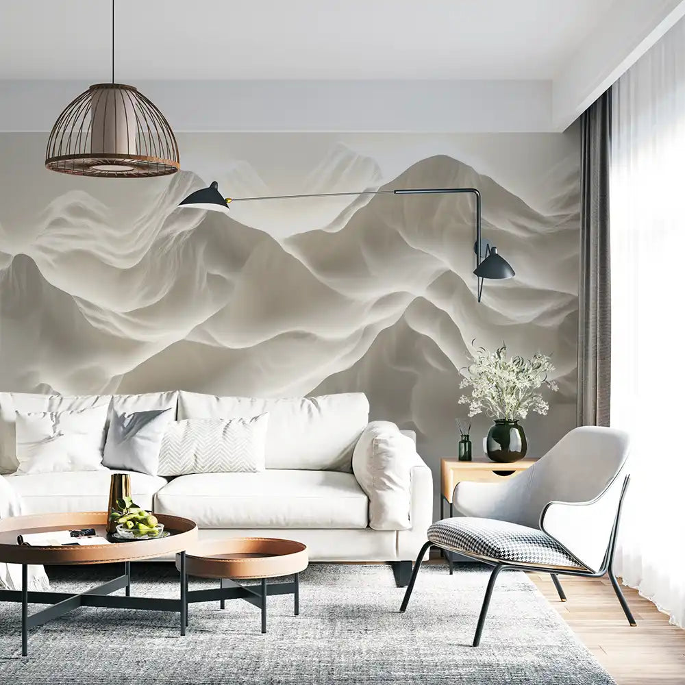 Stylish living room with a cozy sofa and modern wallpaper featuring soft mountain wave design in neutral tones.