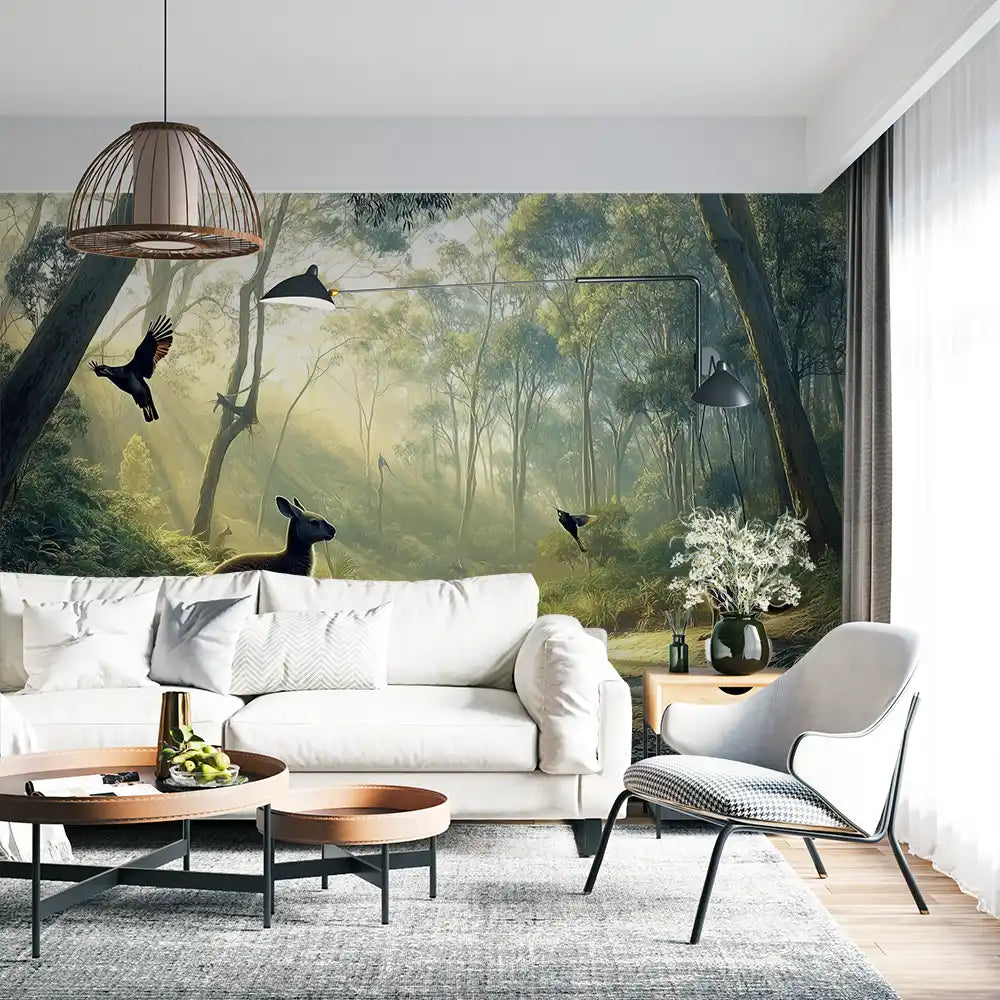 Interior design featuring a forest mural with birds, creating a serene atmosphere in a living room setting.