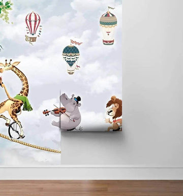 Colorful mural featuring a giraffe, lion, and hippo in a whimsical scene with hot air balloons.
