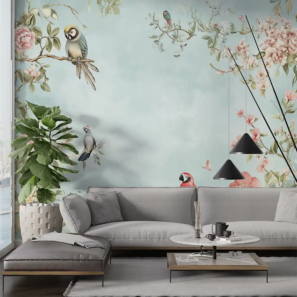 Stylish living room featuring a floral mural with birds, a couch, table, and greenery for a serene atmosphere.