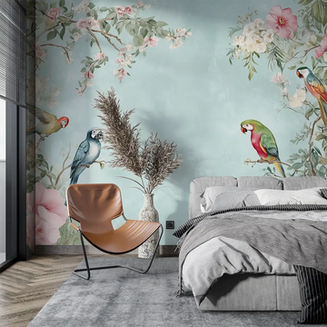 Colorful parrot wallpaper in a stylish bedroom with floral accents, creating a vibrant atmosphere.