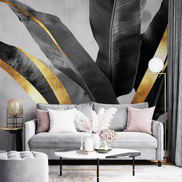 Stylish living room with elegant wallpaper featuring dark leaves and gold accents, showcasing modern interior design.